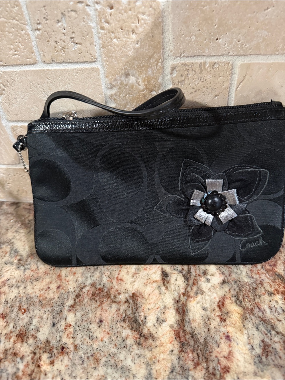 Coach Black Signature Wristlet with Black & Silver Floral Accent